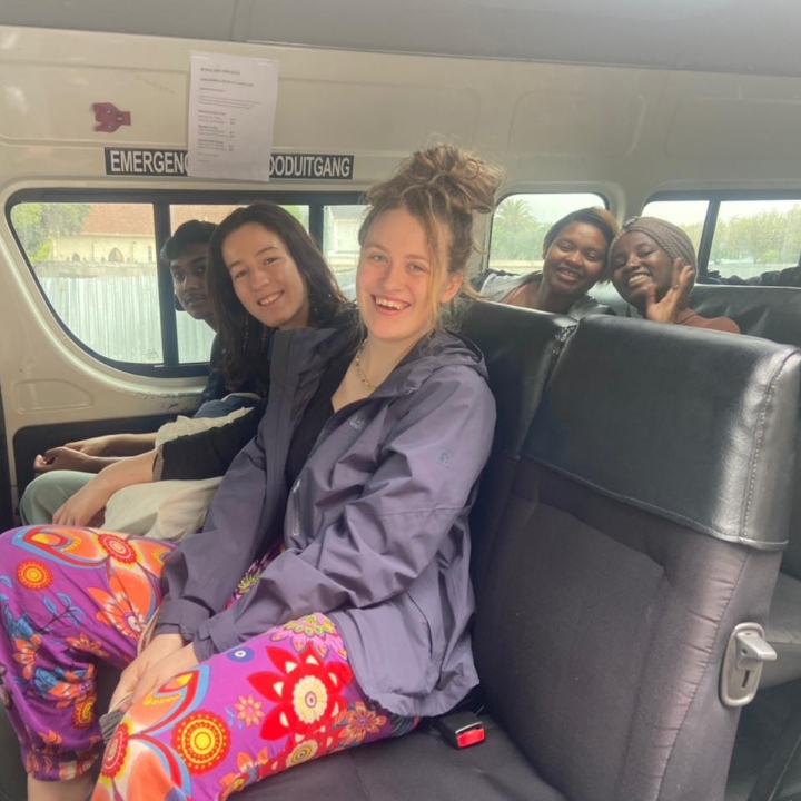 Cosima Kaspar, a Tilting Futures gap year travel program student, hanging with friends on the bus